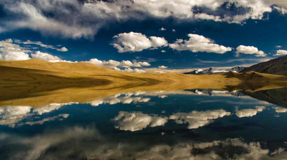 Free Image of Scenic landscape with reflections in a tranquil lake 