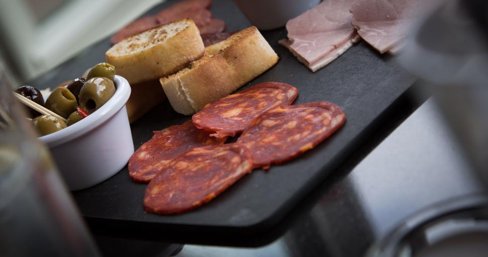 Free Image of Gourmet charcuterie board with olives and assorted meats 