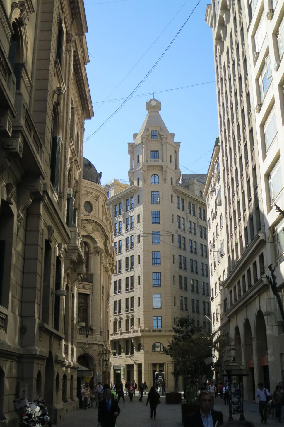 Free Image of Tall building in narrow historic street view daytime 
