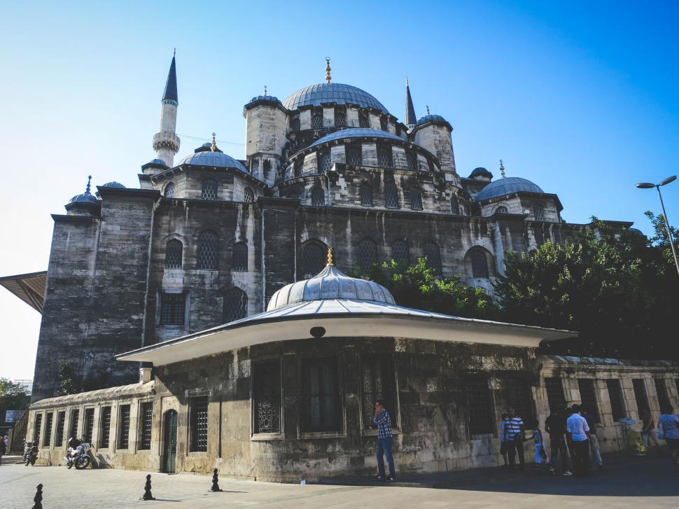 Free Image of Ancient mosque with multiple domes under clear blue sky 