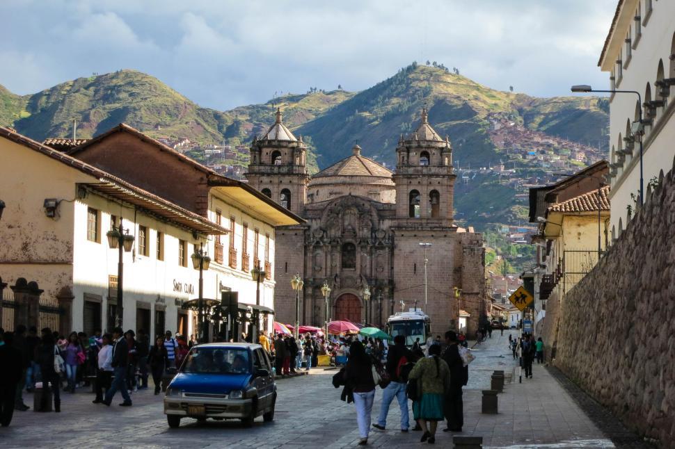 Free Image of Bustling Street Leading to Historical Cathedral in Daylight 