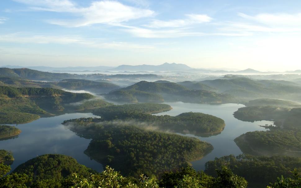 Free Image of Scenic aerial view of lush green islands in clear water. 
