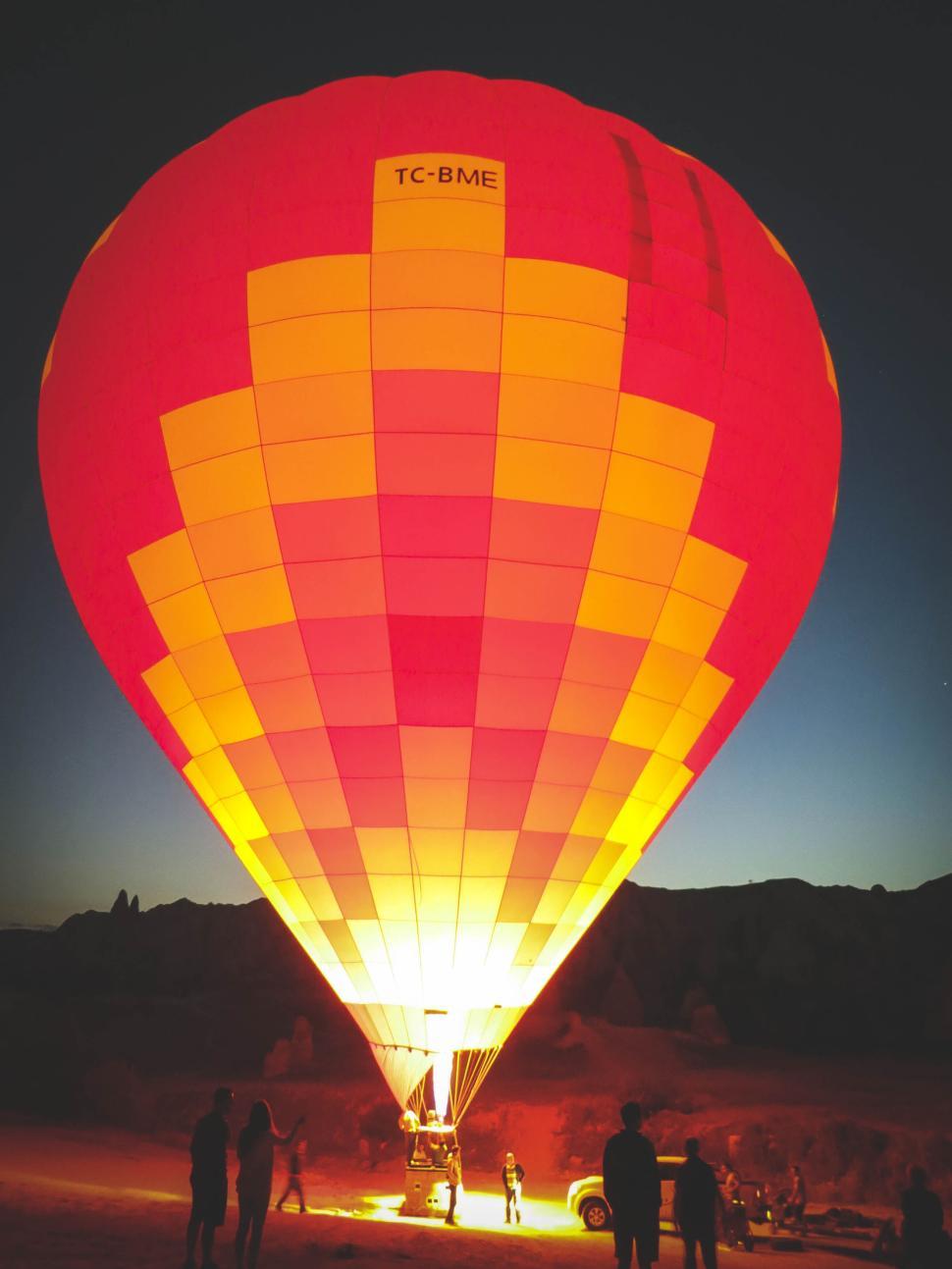 Free Image of Illuminated hot air balloon at night ready for ascent 