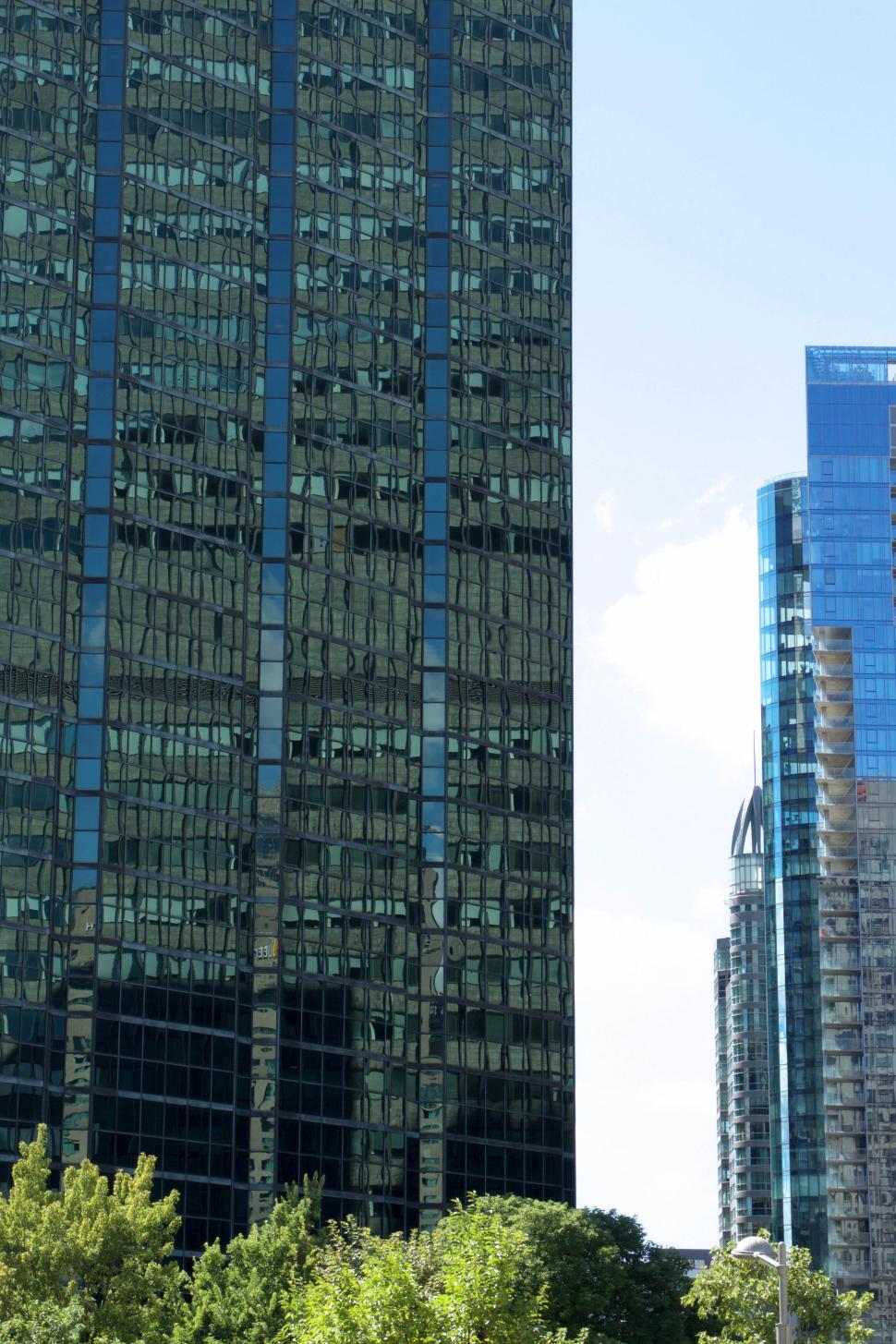 Free Image of Modern high-rise buildings in a cityscape background view. 