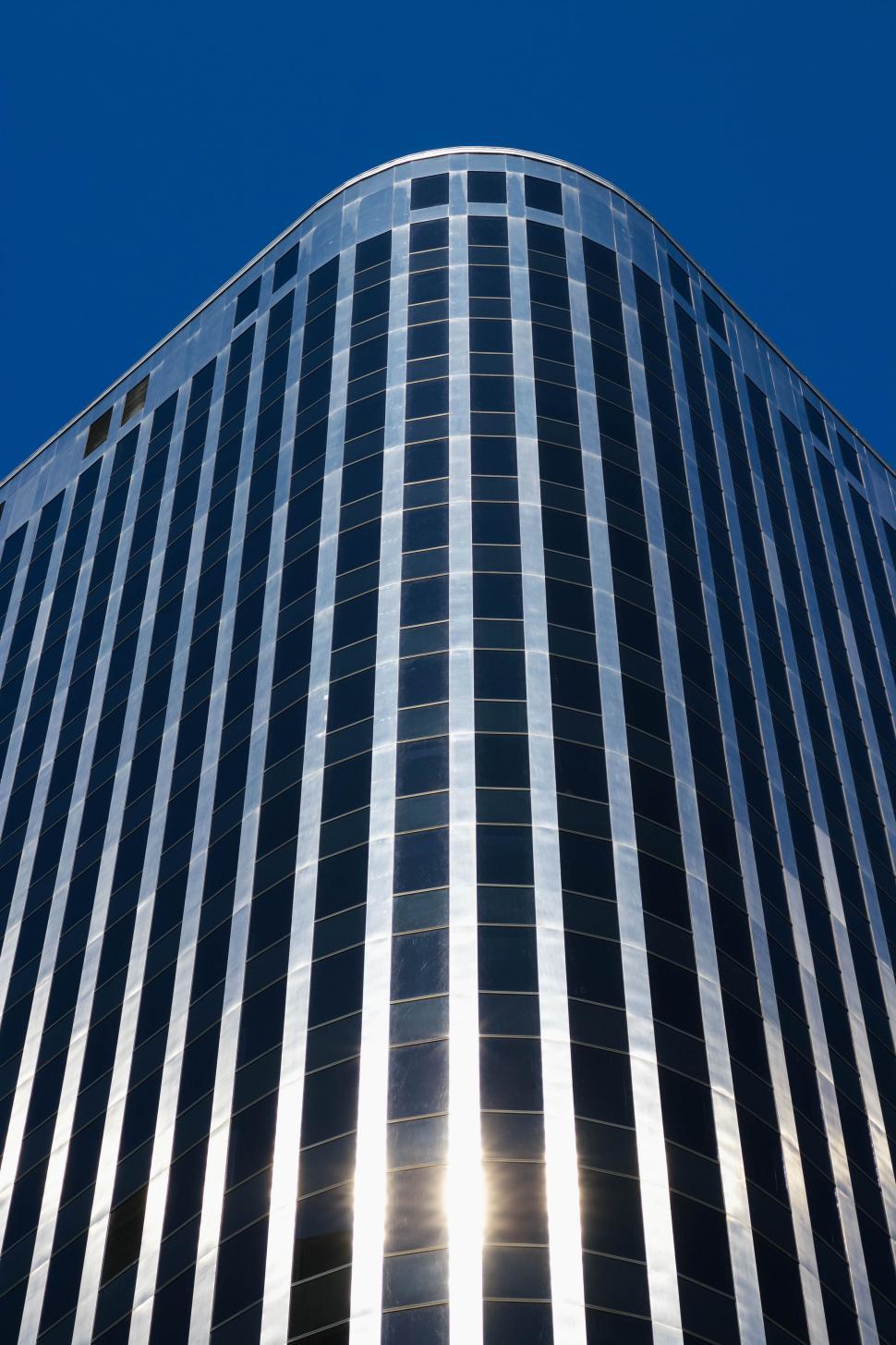 Free Image of Modern skyscraper exterior with reflective glass windows. 