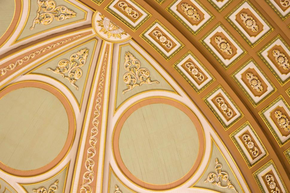 Free Image of Ornate ceiling with gold embellishments and patterns. 