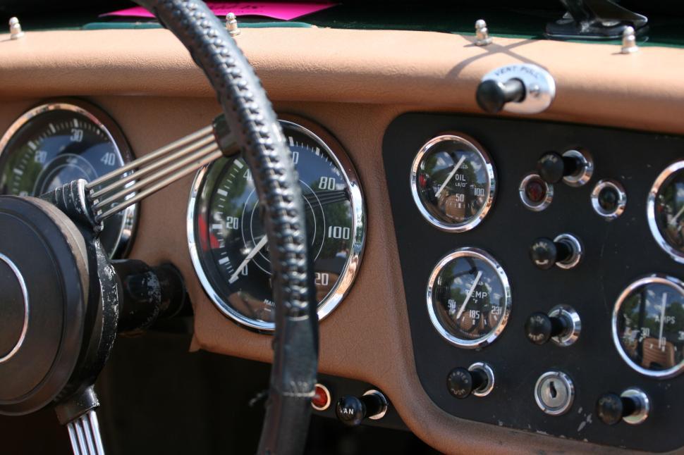 Free Image of Vintage car dashboard with classic gauges and dials 