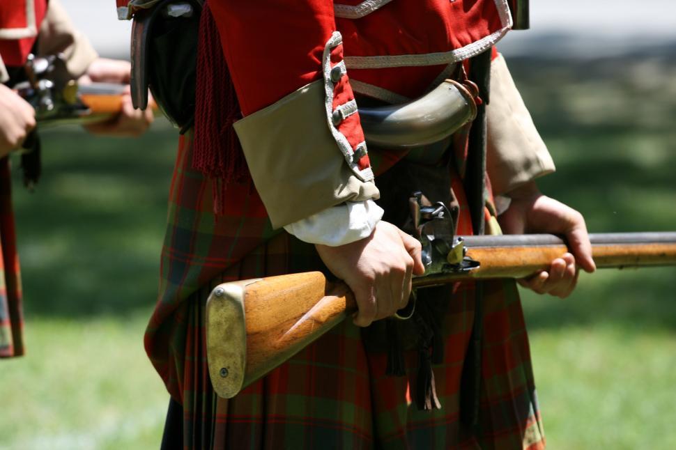 Free Image of Historical reenactment soldier holding a vintage rifle. 