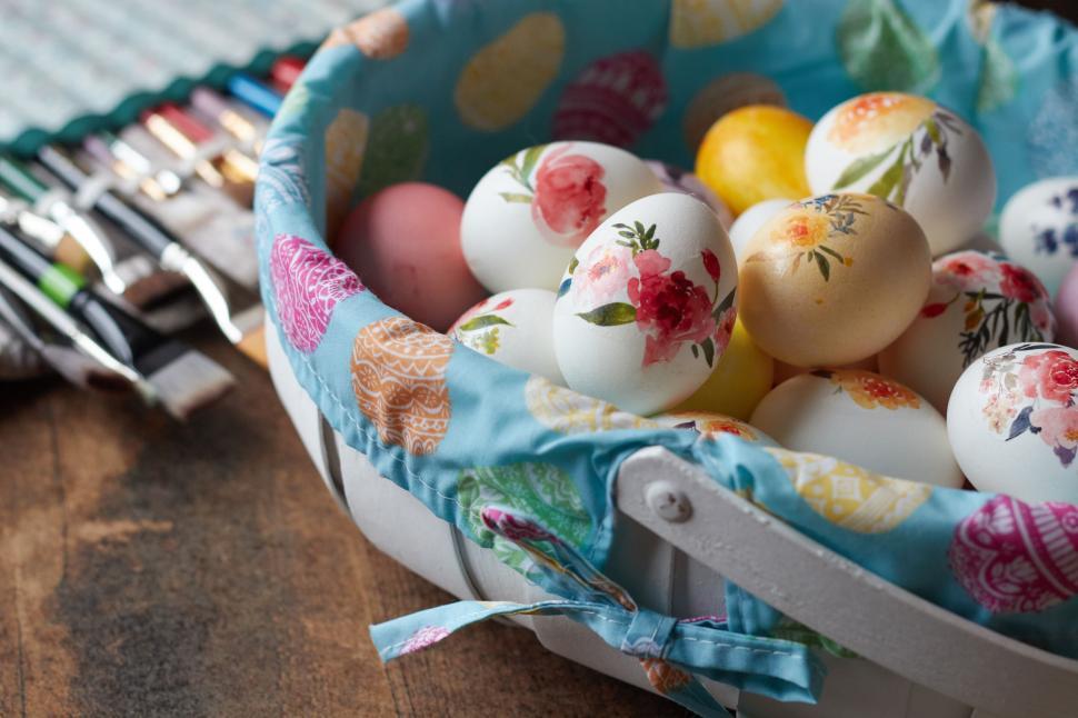Free Image of Colorful decorated eggs in a basket with fabric lining 
