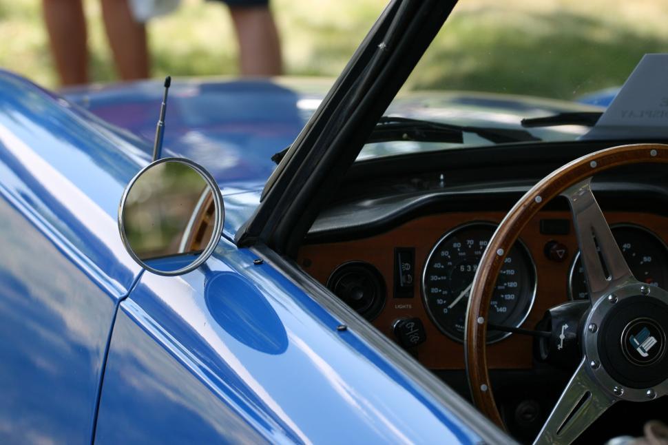 Free Image of Close-up of blue classic car s interior and steering wheel 
