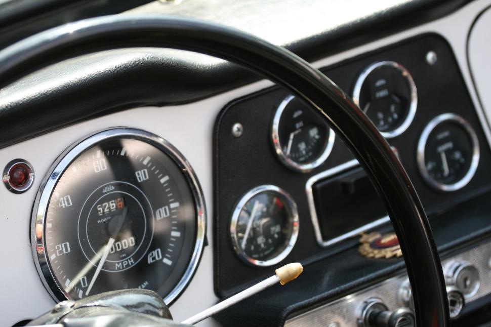 Free Image of Vintage car s interior dashboard with various gauges 