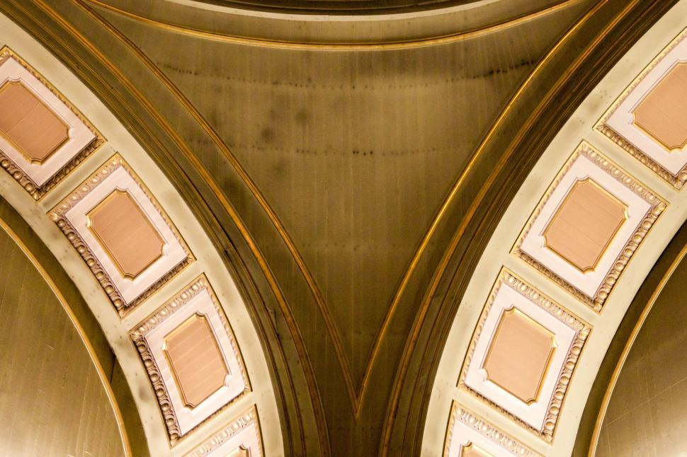 Free Image of Ornate archway with intricate gold and white details. 