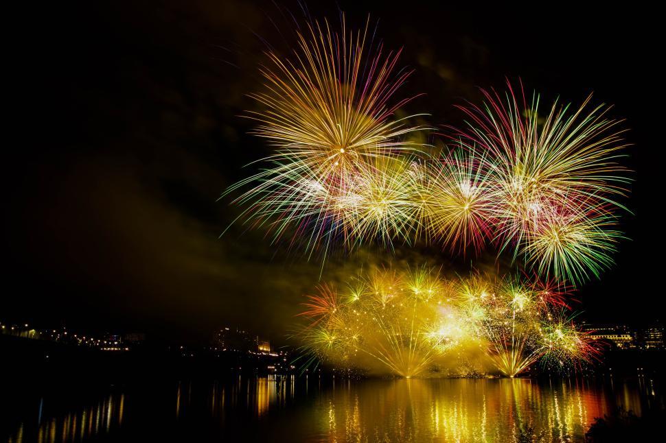 Free Image of Colorful fireworks display over water at night 