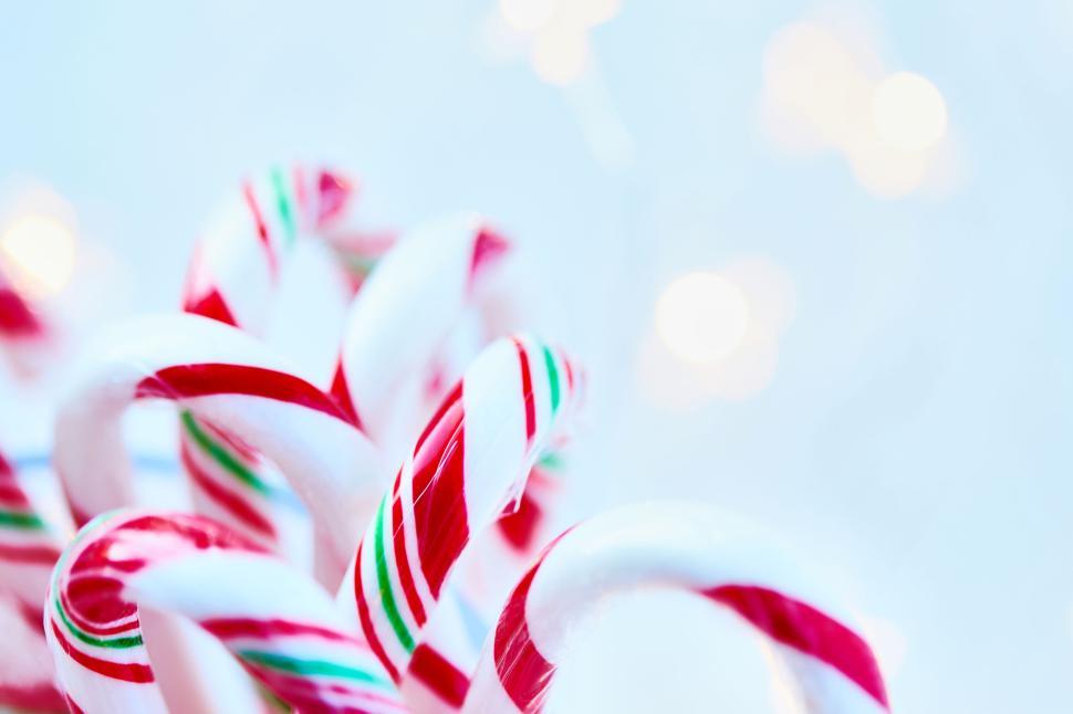 Free Image of Close up of candy canes on a light blue background. 