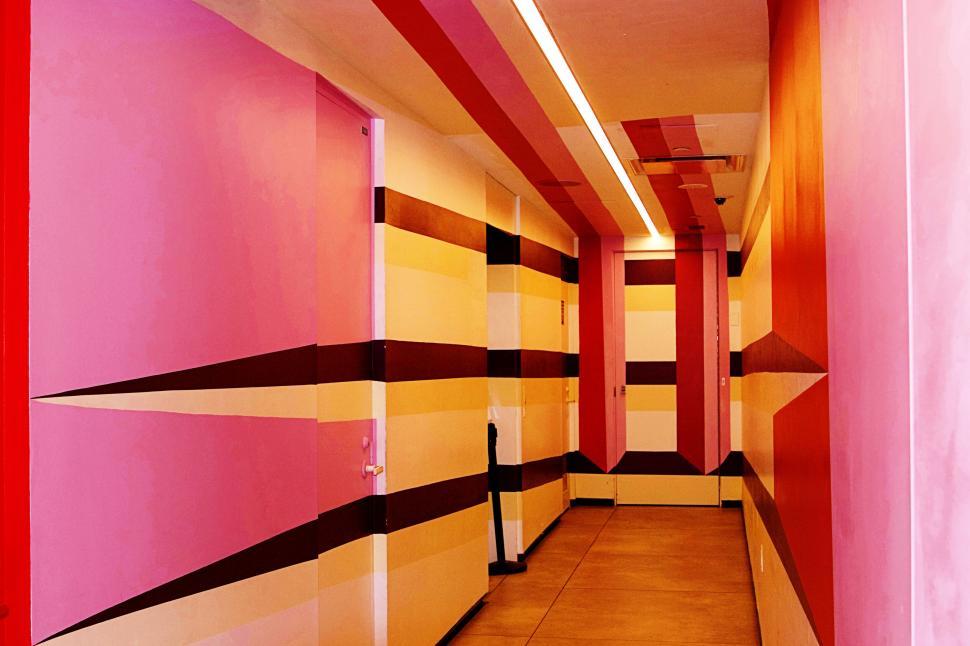 Free Image of Colorfully striped interior hallway with abstract patterns. 