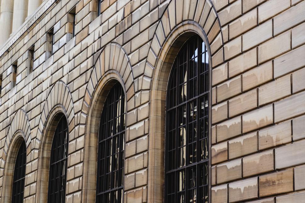 Free Image of Historic building facade with arched windows in a row. 