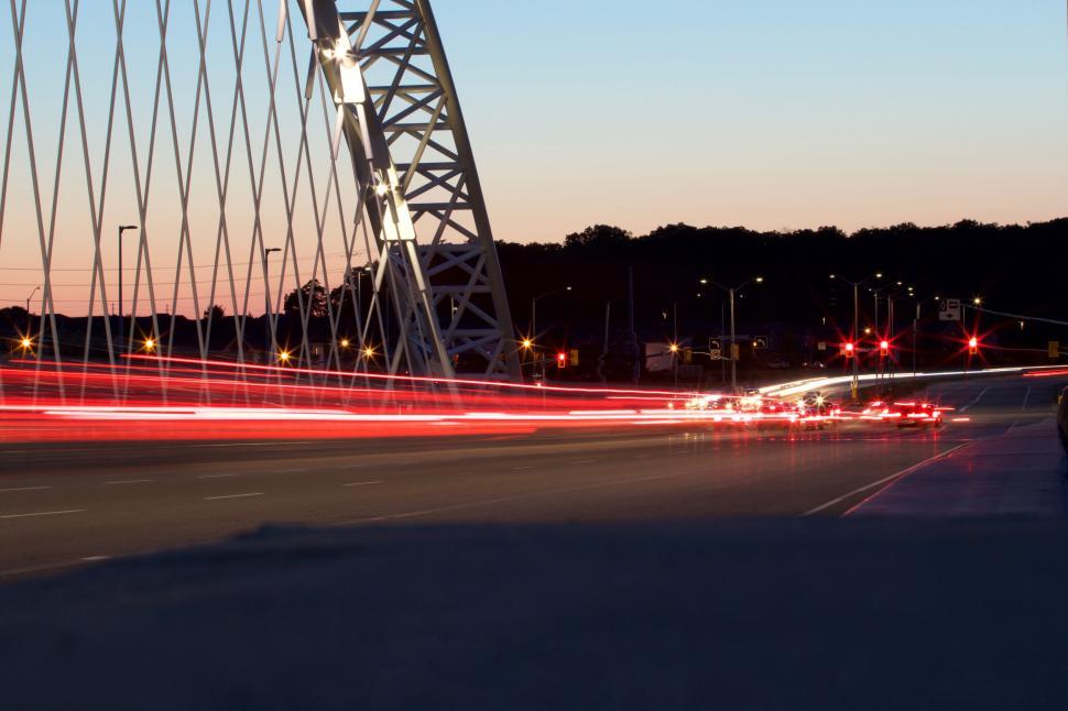 Free Image of City Bridge at Dusk with Light Trails from Vehicles 