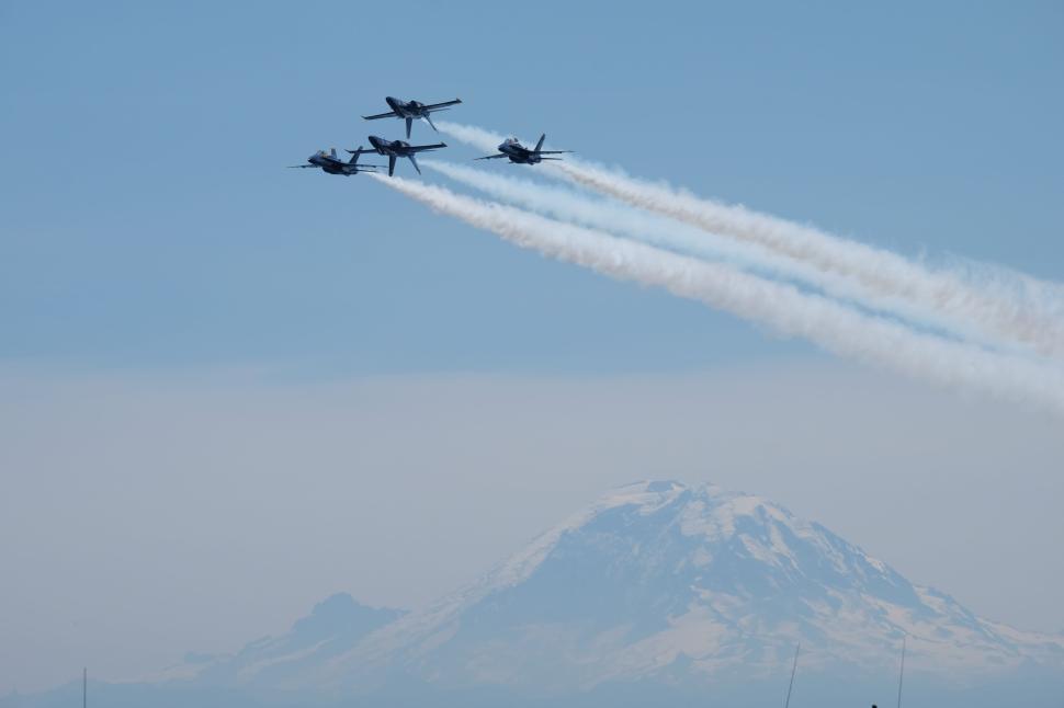 Free Image of Four airplanes flying in formation over Mount Rainier 