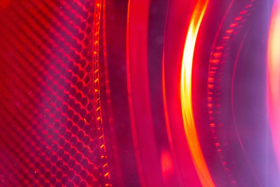 Free Image of Close-up of abstract red light pattern with a glowing center 