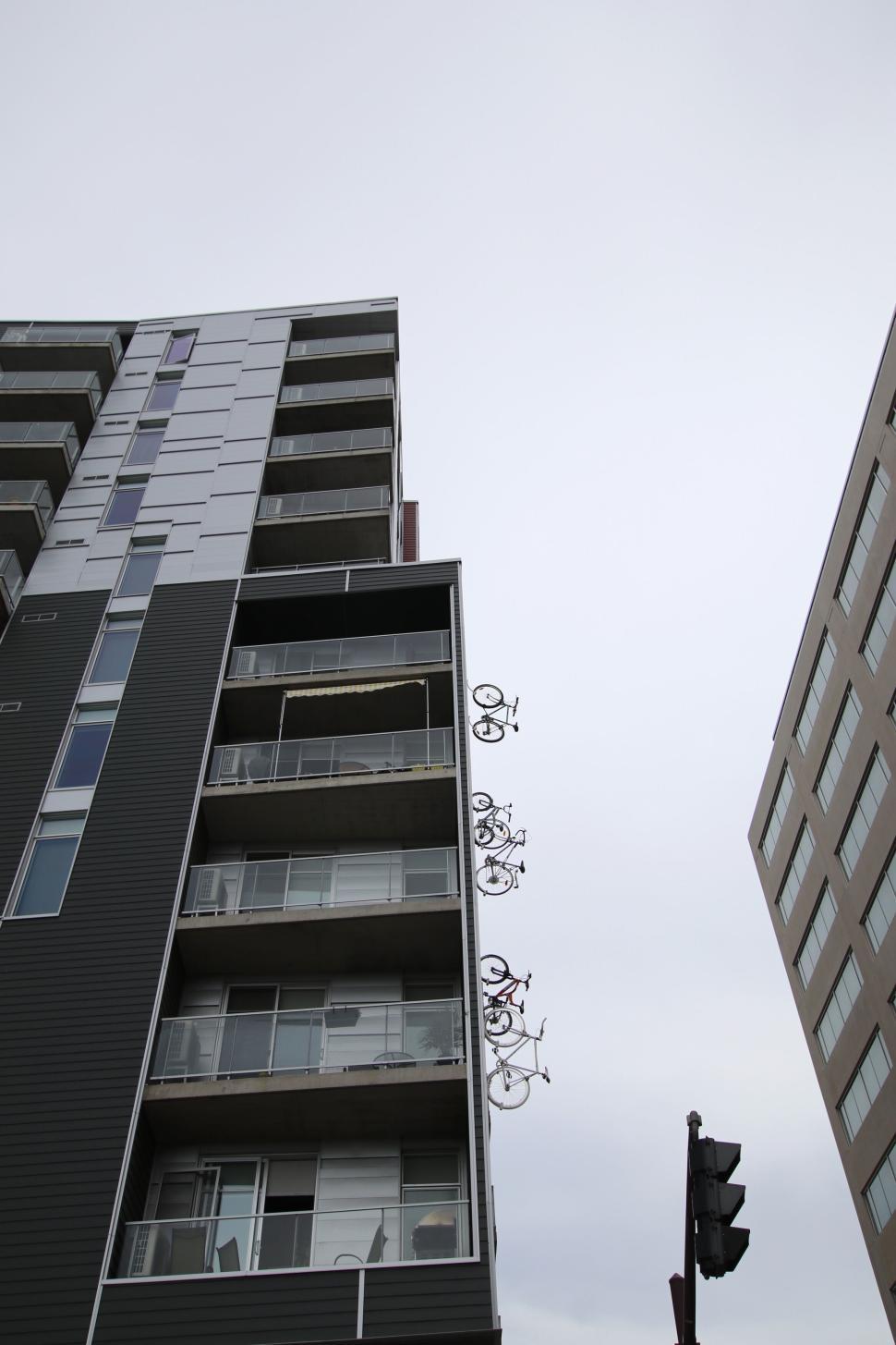 Free Image of Modern apartment building with bicycles on the balcony 