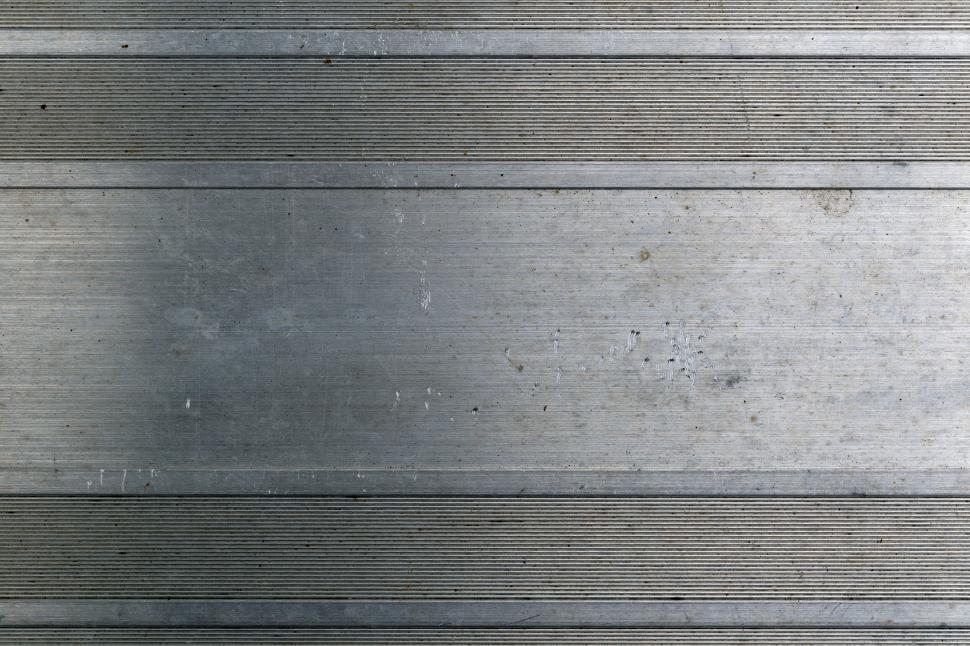 Free Image of Grunge metal panel texture with wear and scratches 