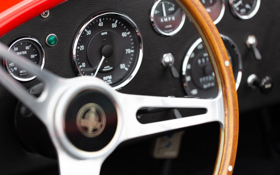 Free Image of Vintage car s wooden steering wheel and dashboard 