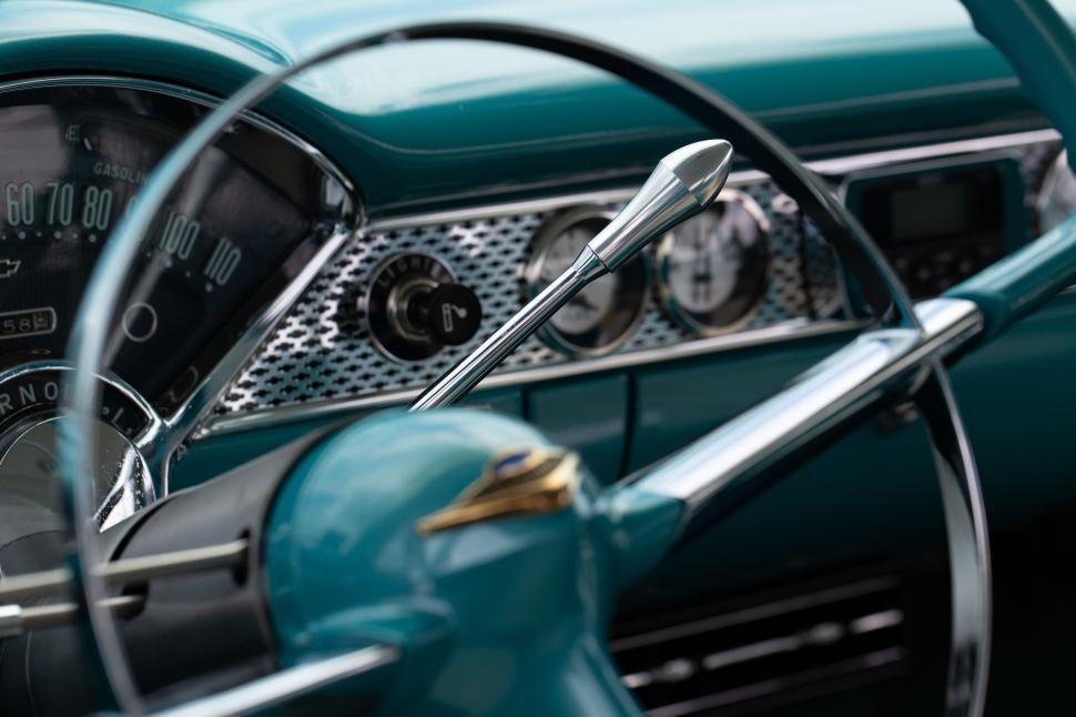 Free Image of Close-up of classic car dashboard and steering wheel. 
