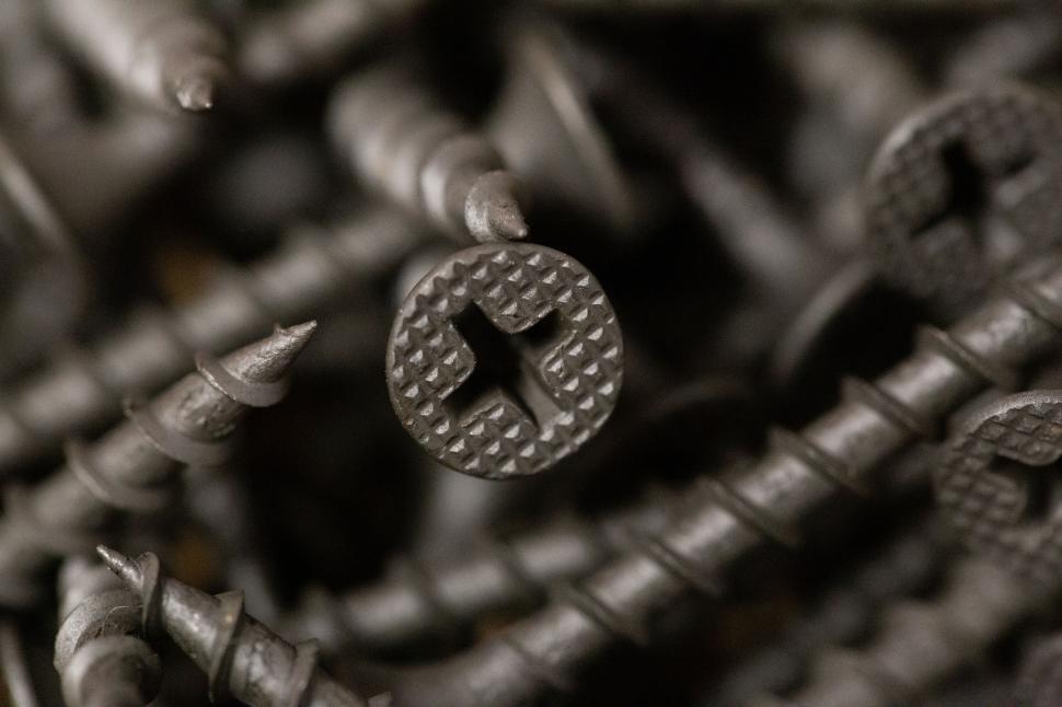 Free Image of Close-up of metal screws with cross-shaped heads 