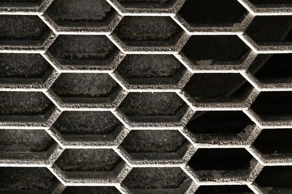 Free Image of Hexagonal shapes forming a grid in industrial setting view. 