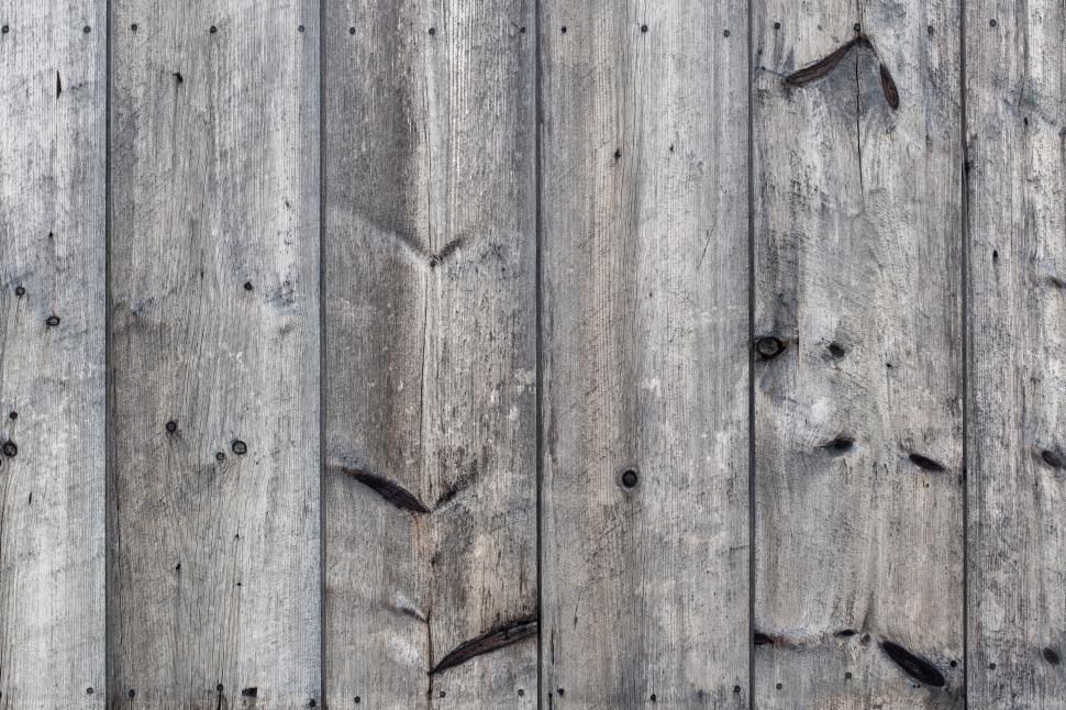 Free Image of Aged wooden planks with knots and weathered texture 