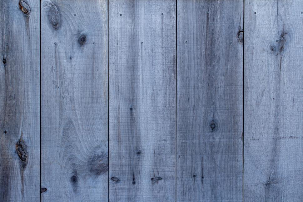Free Image of Weathered blue wooden planks forming a rustic background 
