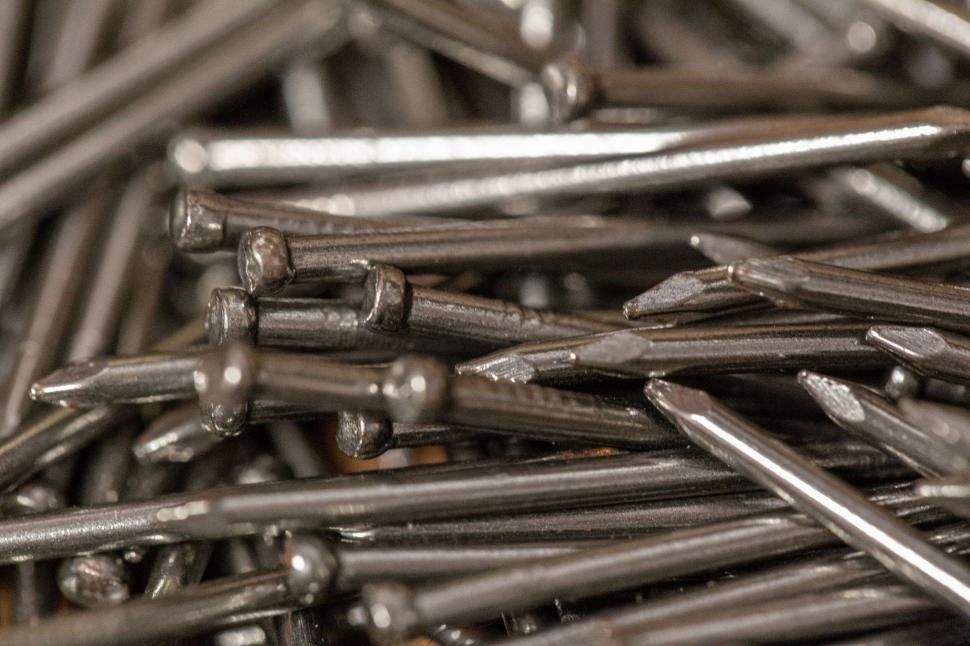 Free Image of Close-up view of several sharp nails arranged together. 