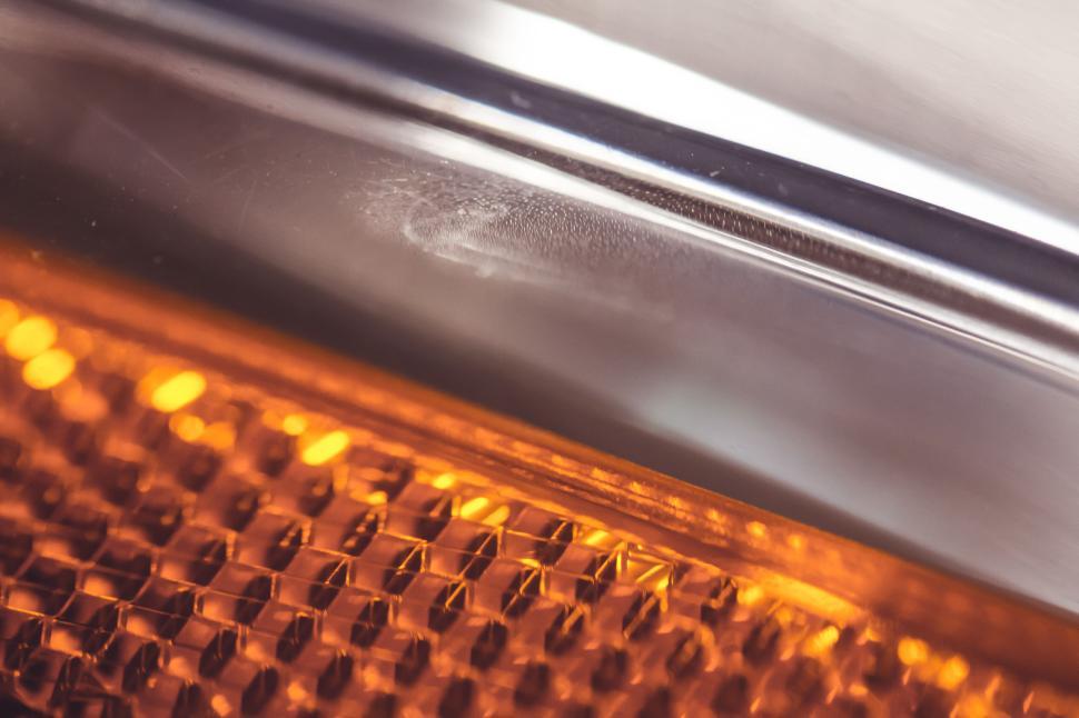 Free Image of Close-up of orange car headlight reflector pattern design 
