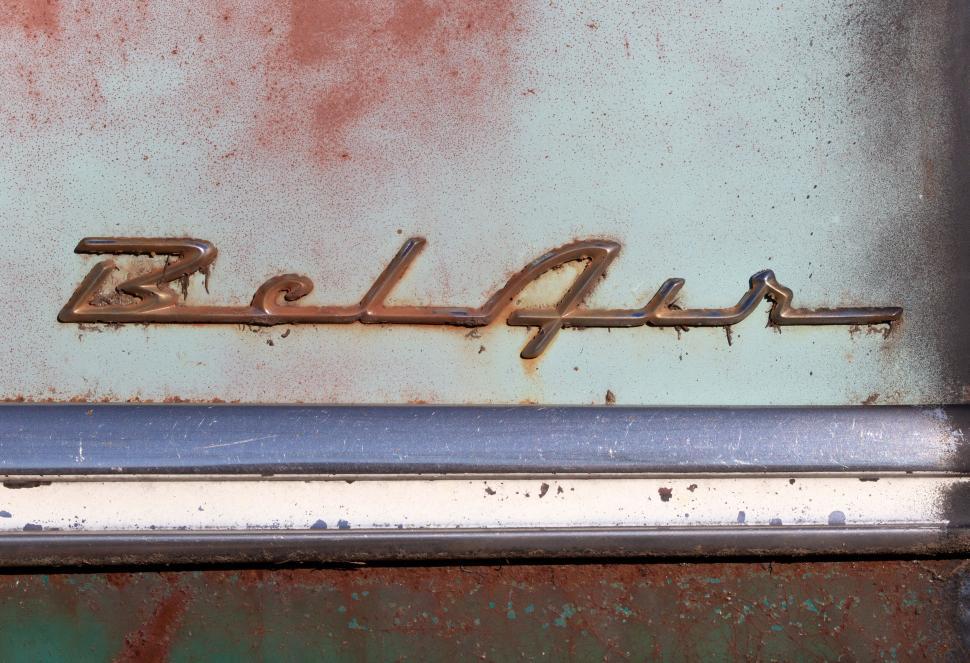 Free Image of Vintage car badge  Bel Air  partially rusted and worn. 