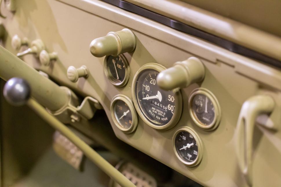 Free Image of Close-up of vintage car dashboard with dials and gauges. 