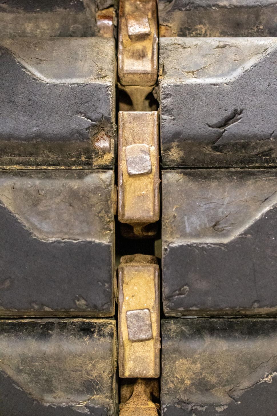 Free Image of Close-up of heavy machinery part with worn surfaces 