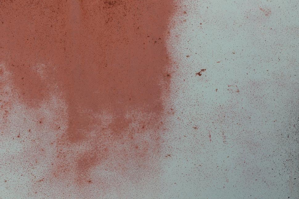 Free Image of Weathered wall with red paint stains creating patterns 