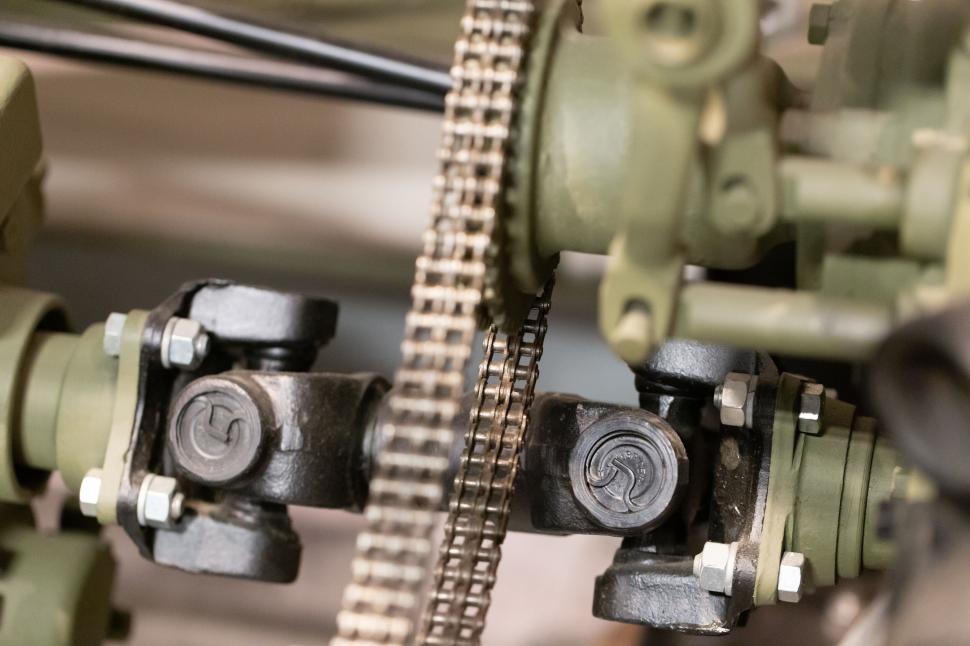 Free Image of Close-up of mechanical parts and chains in motion 