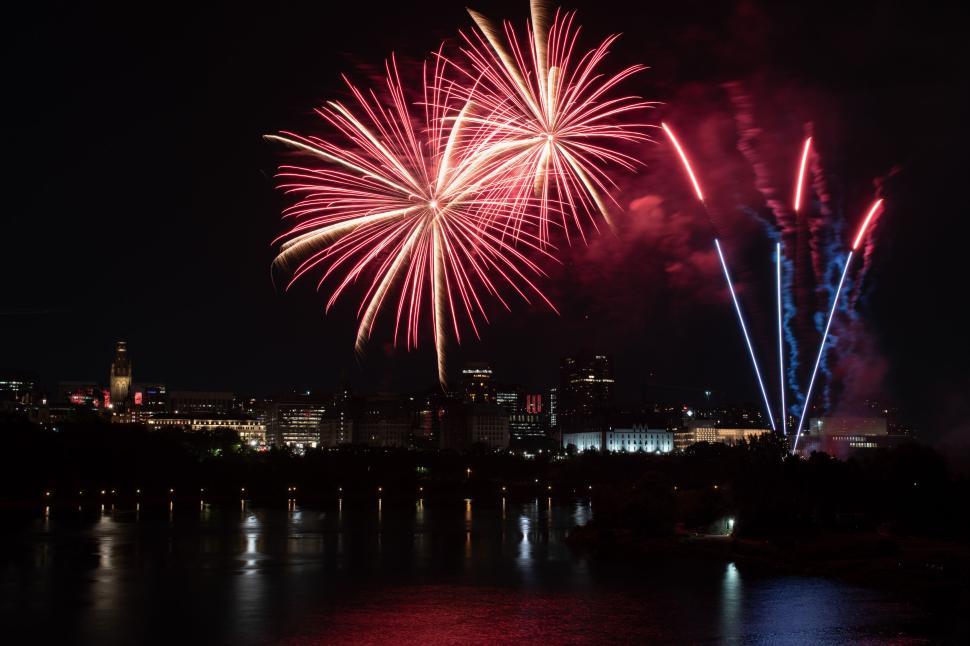 Free Image of Stunning fireworks display over a city skyline view 