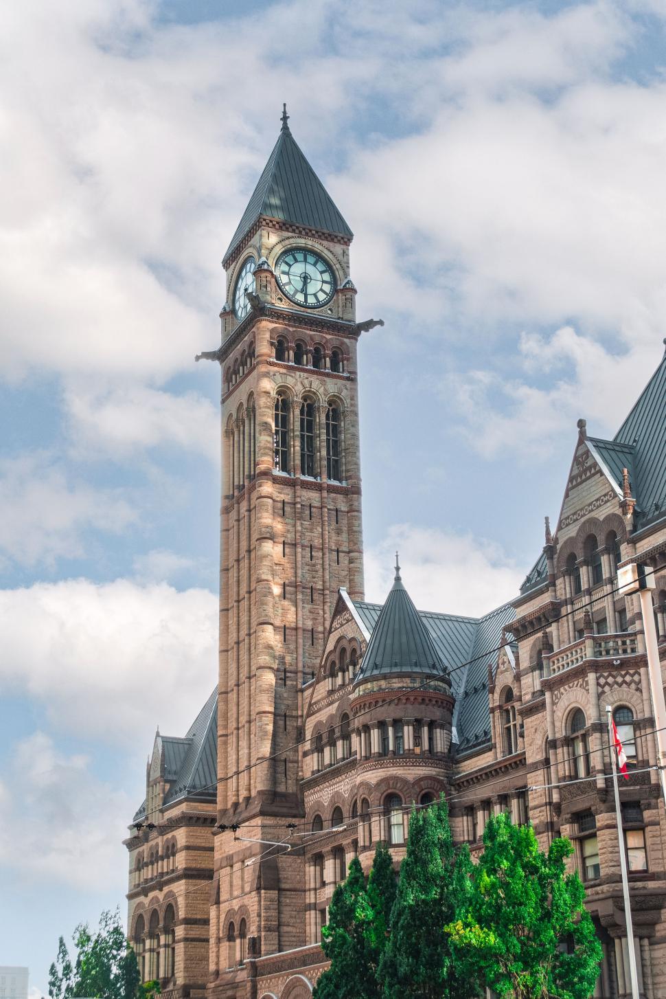 Free Image of Historic clock tower against a cloudy sky background. 