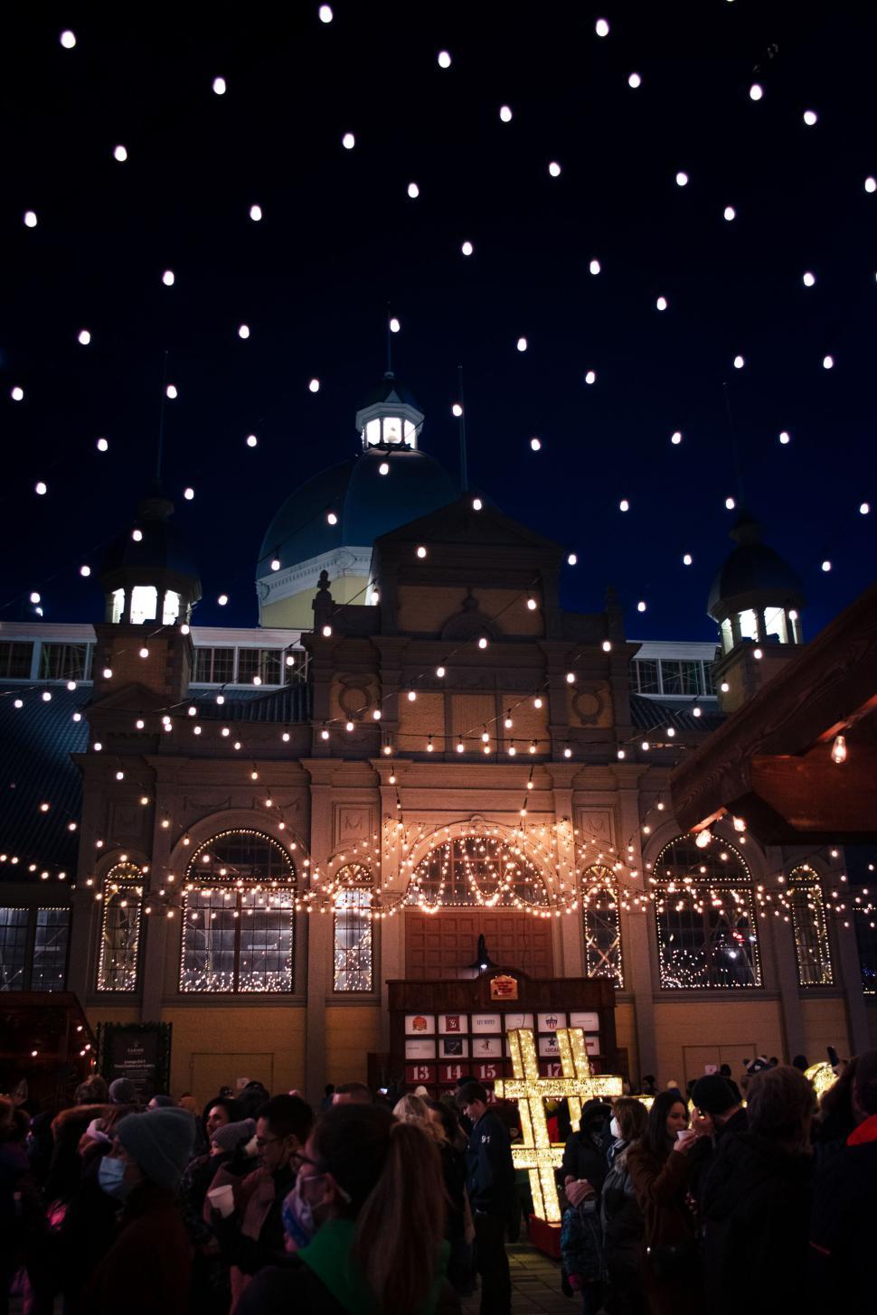 Free Image of Evening Market Lights Illuminate Historical Building Dome. 