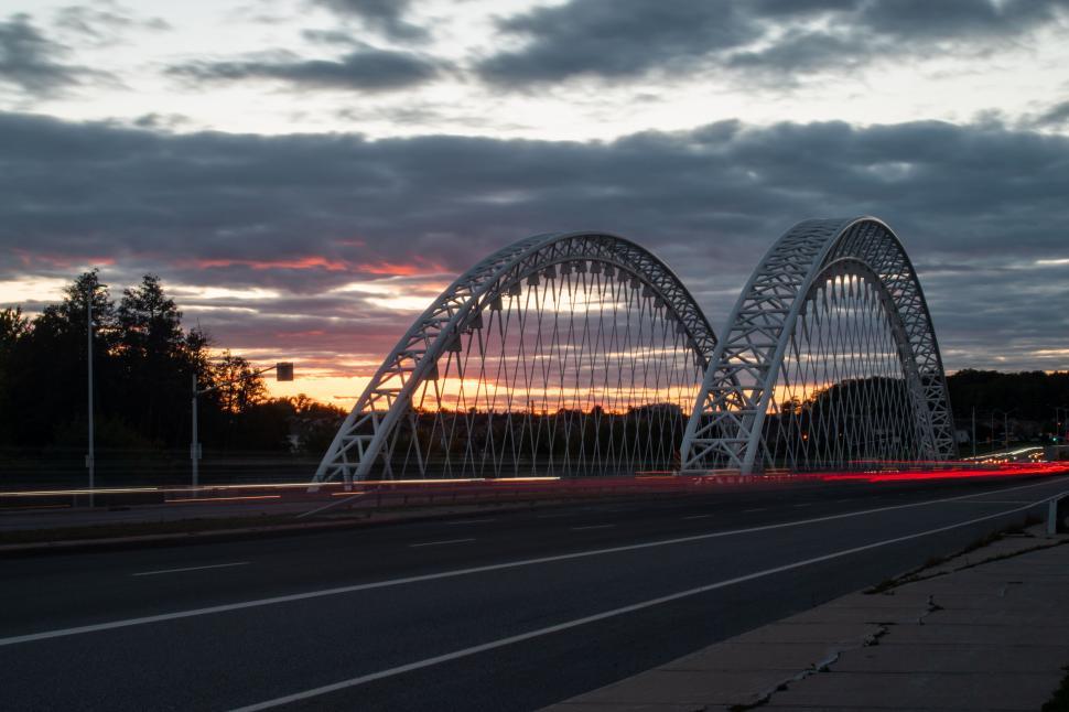 Free Image of Silhouette of a double-arch bridge at sunset 