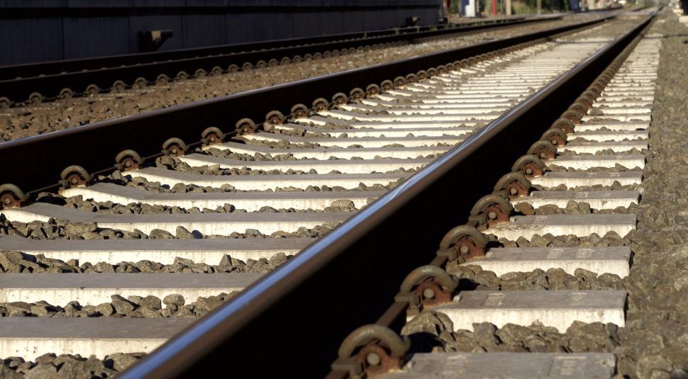 Free Image of Close-up view of empty railway tracks stretching forward. 