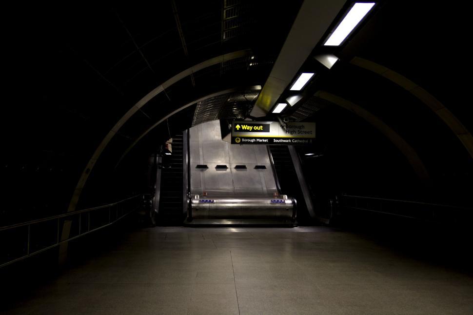 Free Image of Dimly lit underground station with an empty escalator. 