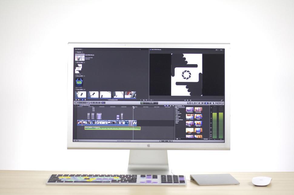 Free Image of Editing video on a computer monitor with software open 