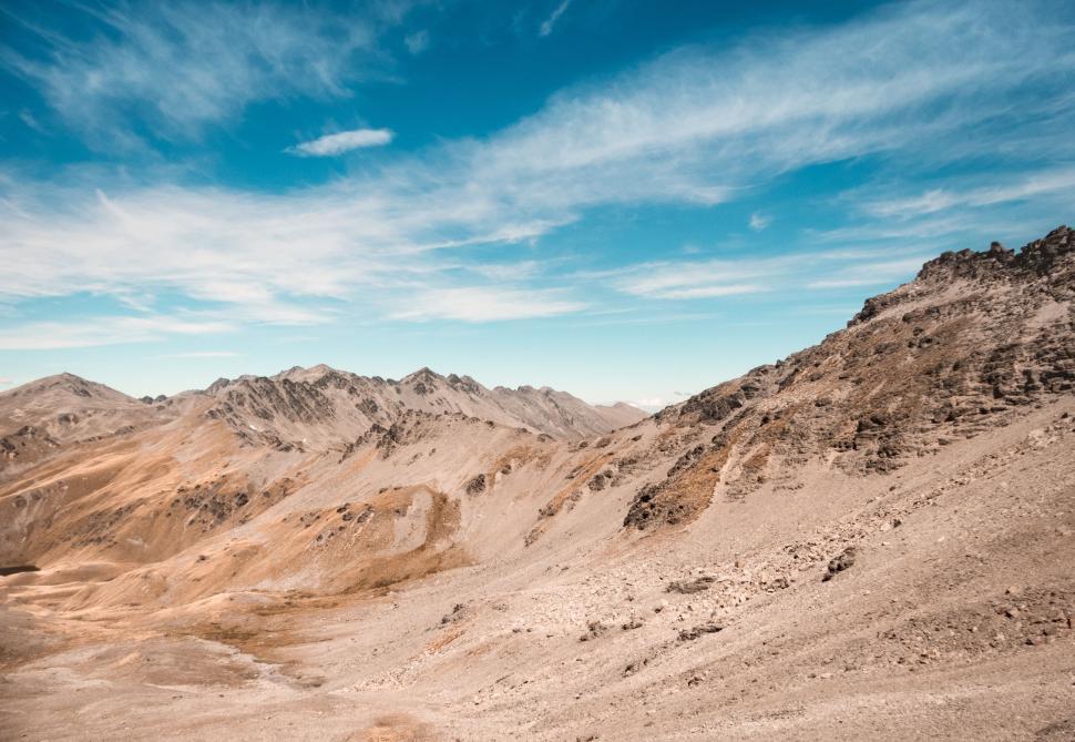 Free Image of Rocky mountain range under blue sky on sunny day 
