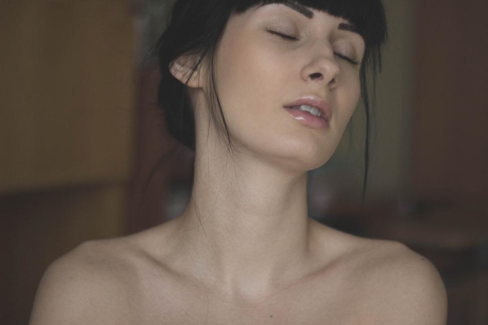 Free Image of Portrait of a serene woman with closed eyes indoors. 
