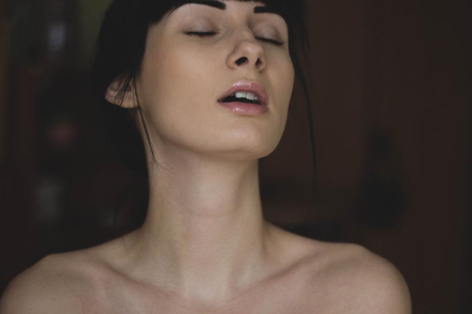 Free Image of Close-up of woman with eyes closed in serene expression 