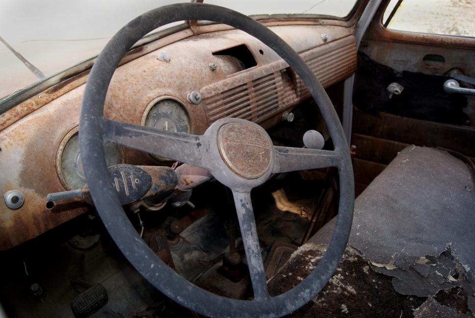 Free Image of Inside an old rusted car 