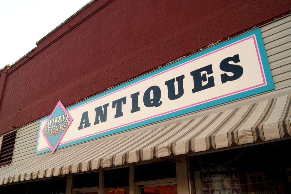 Free Image of Antique Shop Sign in Shopping Street 